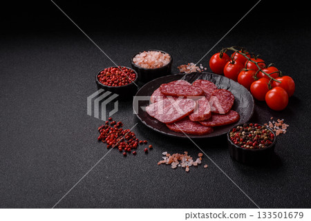 Sliced salami sausage, smoked meat as a delicacy for the table. Salami sausage 133501679