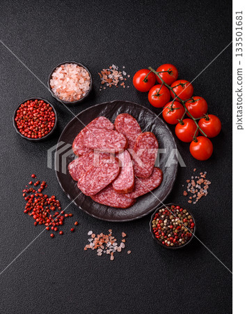Sliced salami sausage, smoked meat as a delicacy for the table. Salami sausage 133501681