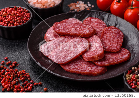 Sliced salami sausage, smoked meat as a delicacy for the table. Salami sausage 133501683
