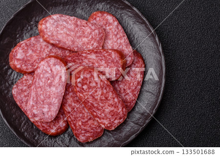 Sliced salami sausage, smoked meat as a delicacy for the table. Salami sausage 133501688