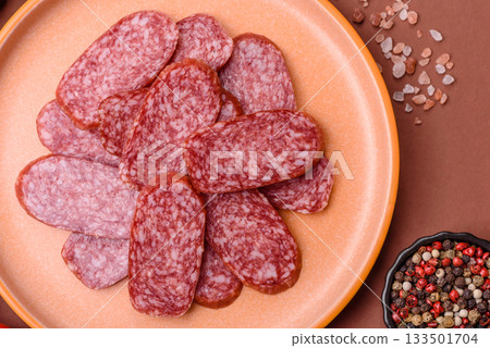 Sliced salami sausage, smoked meat as a delicacy for the table. Salami sausage 133501704