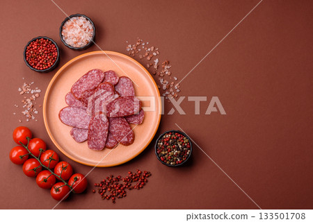 Sliced salami sausage, smoked meat as a delicacy for the table. Salami sausage 133501708