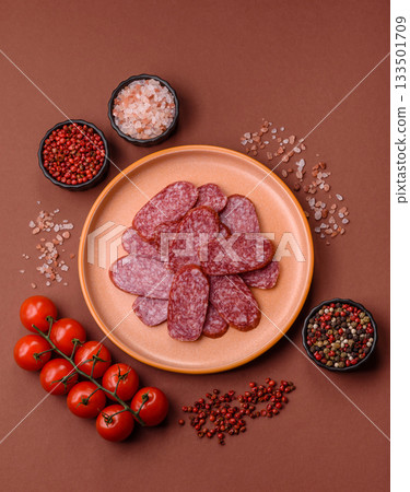 Sliced salami sausage, smoked meat as a delicacy for the table. Salami sausage 133501709