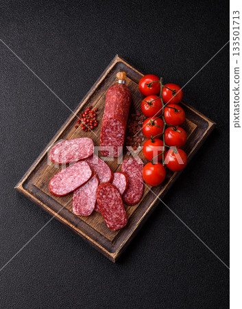 Sliced salami sausage, smoked meat as a delicacy for the table. Salami sausage 133501713