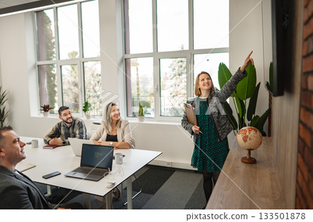 Woman Presenting to Group in office Woman Presenting to Group in office 133501878