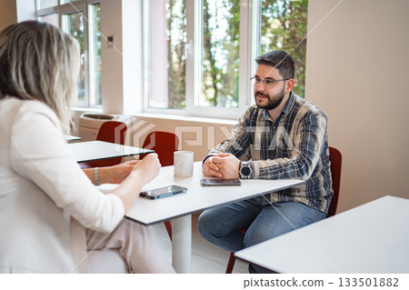 Man Sitting at Table With Woman 133501882