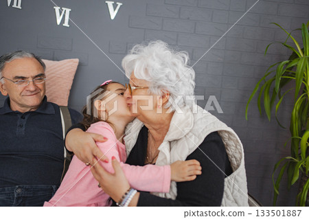 Sweet moment of grandma and granddaughter at home Sweet moment of grandma and granddaughter at home 133501887