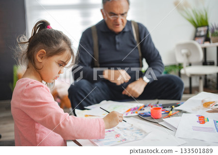 Art session: bonding time for child and grandpa 133501889