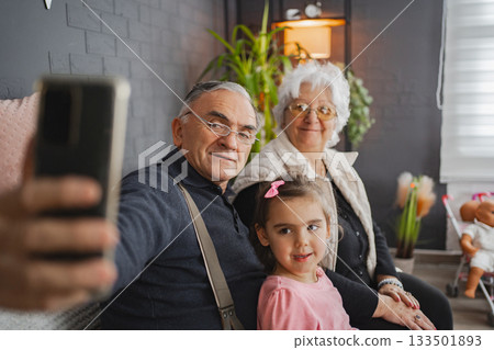Family joy in a cozy autumn living room 133501893