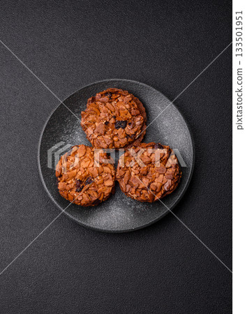 Chocolate chip cookies with caramelized nuts, a healthy sweet snack. Nut cookies Chocolate chip cookies with caramelized nuts, a healthy sweet snack. Nut cookies 133501951