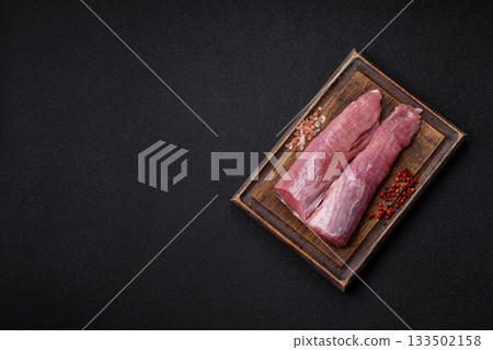 Raw pork tenderloin, fresh meat, a source of protein, and an ingredient for a meal. Pork tenderloin Raw pork tenderloin, fresh meat, a source of protein, and an ingredient for a meal. Pork tenderloin 133502158