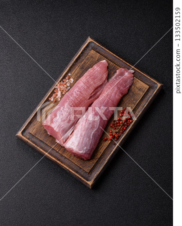 Raw pork tenderloin, fresh meat, a source of protein, and an ingredient for a meal. Pork tenderloin Raw pork tenderloin, fresh meat, a source of protein, and an ingredient for a meal. Pork tenderloin 133502159