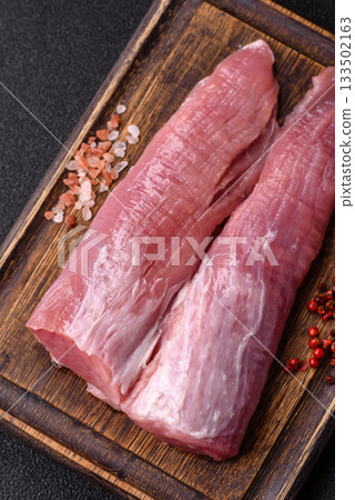 Raw pork tenderloin, fresh meat, a source of protein, and an ingredient for a meal. Pork tenderloin Raw pork tenderloin, fresh meat, a source of protein, and an ingredient for a meal. Pork tenderloin 133502163
