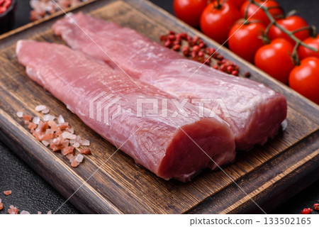 Raw pork tenderloin, fresh meat, a source of protein, and an ingredient for a meal. Pork tenderloin Raw pork tenderloin, fresh meat, a source of protein, and an ingredient for a meal. Pork tenderloin 133502165