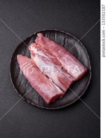 Raw pork tenderloin, fresh meat, a source of protein, and an ingredient for a meal. Pork tenderloin Raw pork tenderloin, fresh meat, a source of protein, and an ingredient for a meal. Pork tenderloin 133502187
