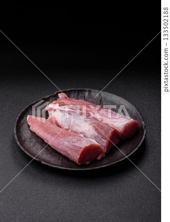 Raw pork tenderloin, fresh meat, a source of protein, and an ingredient for a meal. Pork tenderloin 133502188