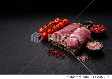Raw pork tenderloin, sliced, is fresh meat, a source of protein. Pork tenderloin 133502204