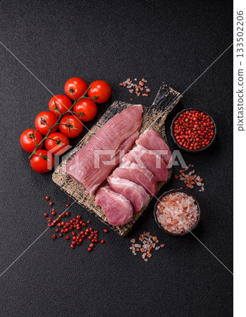 Raw pork tenderloin, sliced, is fresh meat, a source of protein. Pork tenderloin 133502206