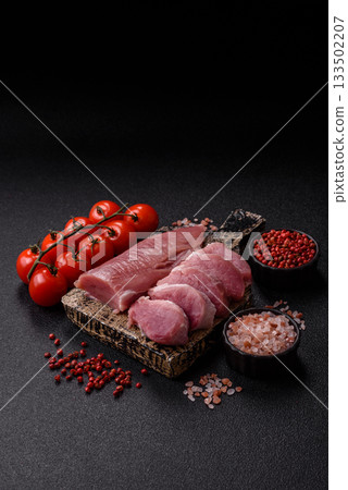 Raw pork tenderloin, sliced, is fresh meat, a source of protein. Pork tenderloin Raw pork tenderloin, sliced, is fresh meat, a source of protein. Pork tenderloin 133502207