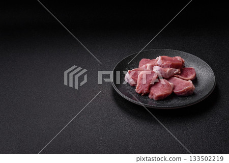 Raw pork tenderloin, sliced, is fresh meat, a source of protein. Pork tenderloin Raw pork tenderloin, sliced, is fresh meat, a source of protein. Pork tenderloin 133502219