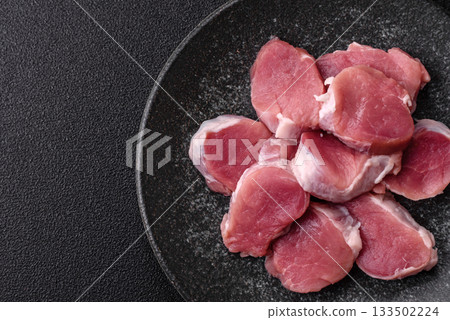 Raw pork tenderloin, sliced, is fresh meat, a source of protein. Pork tenderloin Raw pork tenderloin, sliced, is fresh meat, a source of protein. Pork tenderloin 133502224
