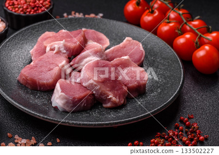 Raw pork tenderloin, sliced, is fresh meat, a source of protein. Pork tenderloin Raw pork tenderloin, sliced, is fresh meat, a source of protein. Pork tenderloin 133502227