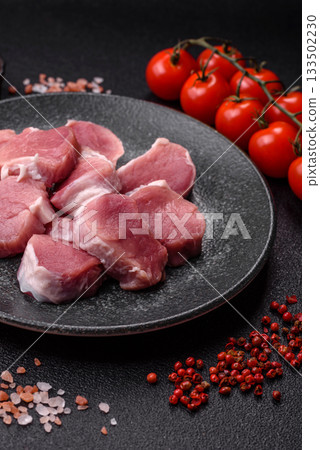 Raw pork tenderloin, sliced, is fresh meat, a source of protein. Pork tenderloin Raw pork tenderloin, sliced, is fresh meat, a source of protein. Pork tenderloin 133502230