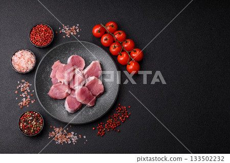 Raw pork tenderloin, sliced, is fresh meat, a source of protein. Pork tenderloin Raw pork tenderloin, sliced, is fresh meat, a source of protein. Pork tenderloin 133502232