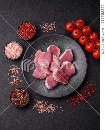 Raw pork tenderloin, sliced, is fresh meat, a source of protein. Pork tenderloin Raw pork tenderloin, sliced, is fresh meat, a source of protein. Pork tenderloin 133502233