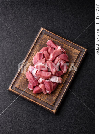 Raw pork, sliced, fresh meat, a source of protein, and an ingredient for a hearty meal. Raw pork 133502237