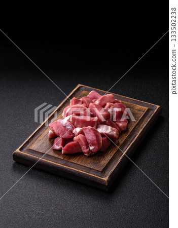 Raw pork, sliced, fresh meat, a source of protein, and an ingredient for a hearty meal. Raw pork 133502238