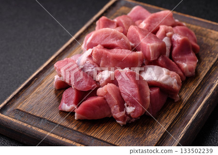 Raw pork, sliced, fresh meat, a source of protein, and an ingredient for a hearty meal. Raw pork 133502239