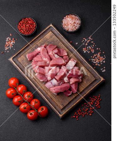 Raw pork, sliced, fresh meat, a source of protein, and an ingredient for a hearty meal. Raw pork Raw pork, sliced, fresh meat, a source of protein, and an ingredient for a hearty meal. Raw pork 133502249