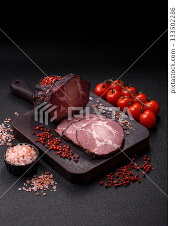 Ham, a meat cooked and sliced for sandwiches or Christmas table. Ham slices Ham, a meat cooked and sliced for sandwiches or Christmas table. Ham slices 133502286