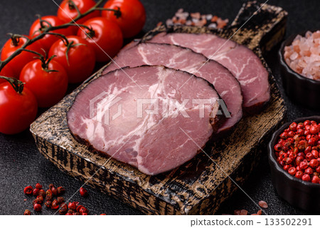 Ham, a meat cooked and sliced for sandwiches or Christmas table. Ham slices Ham, a meat cooked and sliced for sandwiches or Christmas table. Ham slices 133502291