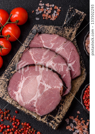 Ham, a meat cooked and sliced for sandwiches or Christmas table. Ham slices Ham, a meat cooked and sliced for sandwiches or Christmas table. Ham slices 133502293