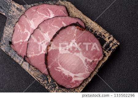Ham, a meat cooked and sliced for sandwiches or Christmas table. Ham slices Ham, a meat cooked and sliced for sandwiches or Christmas table. Ham slices 133502296