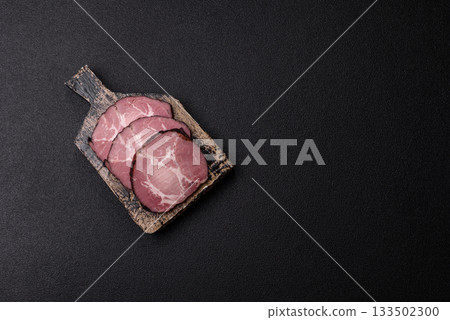 Ham, a meat cooked and sliced for sandwiches or Christmas table. Ham slices Ham, a meat cooked and sliced for sandwiches or Christmas table. Ham slices 133502300
