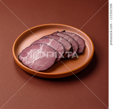 Ham, a meat cooked and sliced for sandwiches or Christmas table. Ham slices 133502306