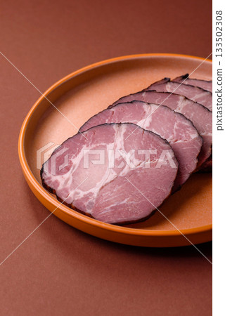 Ham, a meat cooked and sliced for sandwiches or Christmas table. Ham slices 133502308