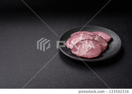 Ham, a meat cooked and sliced for sandwiches or Christmas table. Ham slices Ham, a meat cooked and sliced for sandwiches or Christmas table. Ham slices 133502316