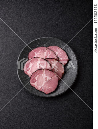Ham, a meat cooked and sliced for sandwiches or Christmas table. Ham slices Ham, a meat cooked and sliced for sandwiches or Christmas table. Ham slices 133502318