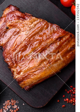 Grilled or barbecued pork or beef ribs with sauce. Cooked or smoked ribs Grilled or barbecued pork or beef ribs with sauce. Cooked or smoked ribs 133502342
