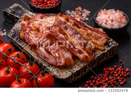 Fried pork bacon slices or strips as a breakfast ingredient. Fried bacon 133502478