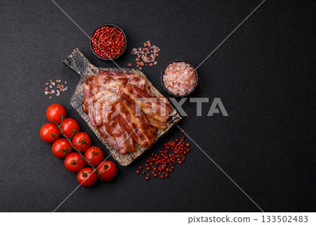 Fried pork bacon slices or strips as a breakfast ingredient. Fried bacon 133502483