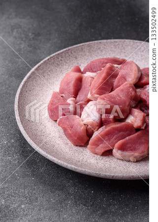 Raw pork, sliced, fresh meat, a source of protein, and an ingredient for a hearty meal. Raw pork Raw pork, sliced, fresh meat, a source of protein, and an ingredient for a hearty meal. Raw pork 133502499