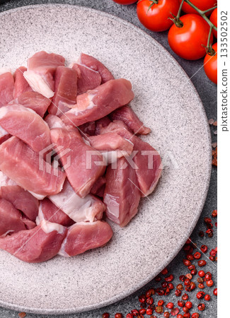 Raw pork, sliced, fresh meat, a source of protein, and an ingredient for a hearty meal. Raw pork 133502502
