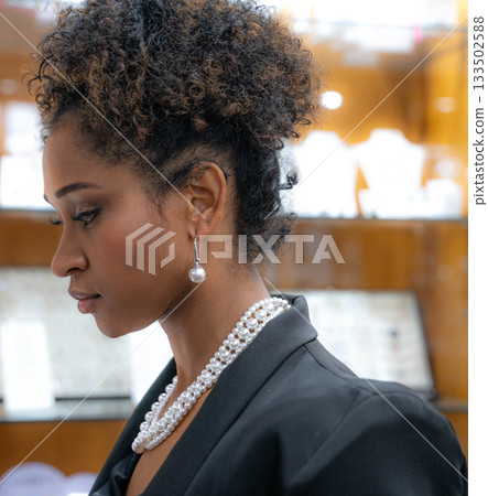 Thoughtful African American Woman in Jewelry 133502588