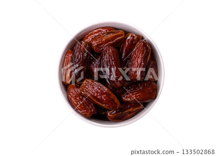 Dried dates in a ceramic plate, arabic food for the ramadan table. Dried dates as a food backgrounds Dried dates in a ceramic plate, arabic food for the ramadan table. Dried dates as a food backgrounds 133502868