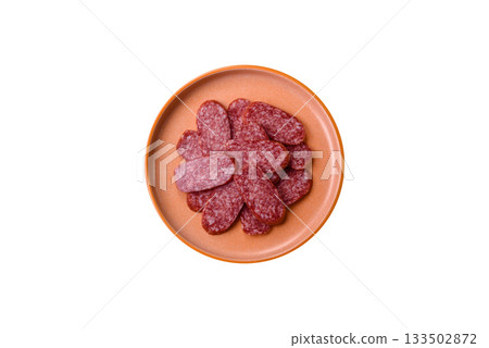 Sliced salami sausage, smoked meat as a delicacy for the table. Salami sausage 133502872